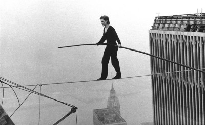 Philippe Petit, a French high wire artist, walks across a tightrope suspended between the World Trade Center's Twin Towers. New York, Aug. 7, 1974. (AP Photo/Alan Welner)